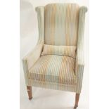 A Greengate furniture Ltd high back armchair in green stripes, 114cm high Condition Report:
