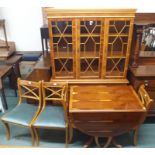 A yew wood display cabinet, 184cm high x 121cm wide x 46cm deep and a dining table with four