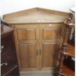 An oak corner cabinet, 105cm high x 99cm wide x 62cm deep Condition Report: Available upon request
