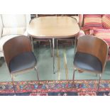 A modern table with four nesting chairs on chrome legs, 77cm high x 84cm wide x 84cm deep