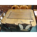 An oak extending dining table and two balloon back chairs (3) Condition Report: Available upon