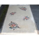 A Chinese floral wool rug, 363cm x 272cm Condition Report: Available upon request