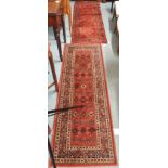 Two red ground Royal Keshan runners, 180cm x 60cm (2) Condition Report: Available upon request
