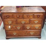 A Georgian oak chest of drawers with brass fittings on bracket feet, 84cm high x 103cm wide x 44cm