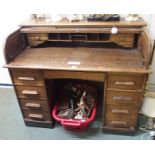 An oak roll top pedestal desk, 101cm high x 121cm wide x 69cm deep Condition Report: Available