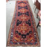 A Blue ground Karajeh runner, 400cm x 122cm Condition Report: