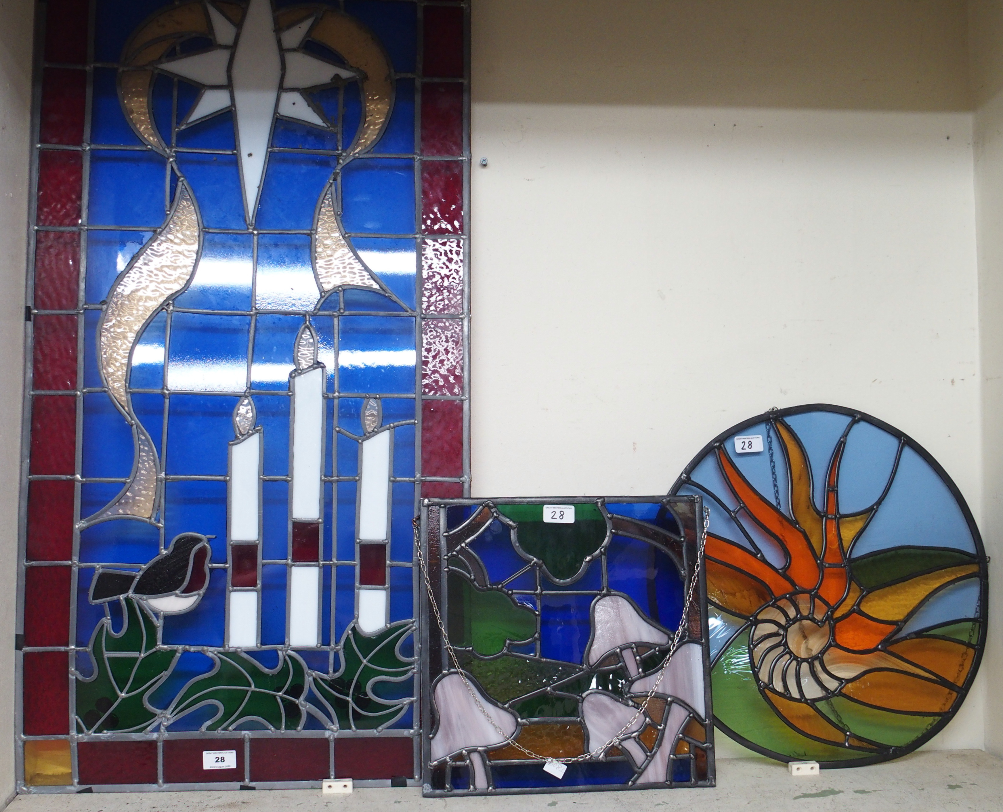 A modern stained glass panel, 115cm high x 54cm wide and two smaller panels (3) Condition Report: