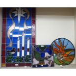 A modern stained glass panel, 115cm high x 54cm wide and two smaller panels (3) Condition Report: