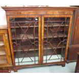 A mahogany bookcase with two glazed doors, 142cm high x 136cm wide x 40cm deep Condition Report: