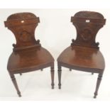 A pair of Victorian oak hall chairs (2) Condition Report: