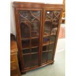 An oak glazed bookcase, 147cm high x 90cm wide x 31cm deep Condition Report: Available upon request