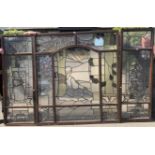 *WITHDRAWN*A large and impressive stained and leaded glass window triptych, the central panel