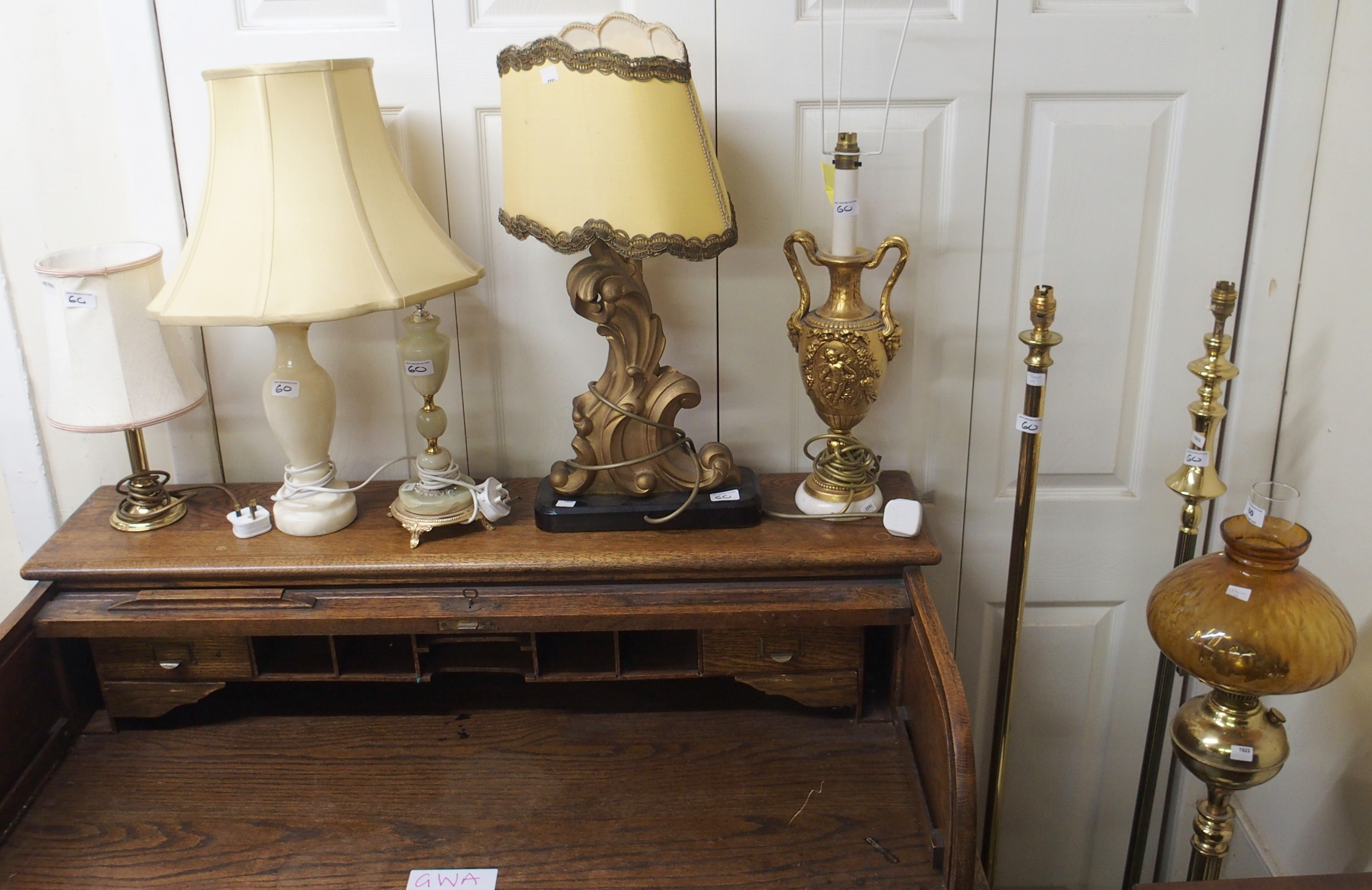 Two brass standard lamps, oil lamp and eight table lamps (11) Condition Report: Available upon
