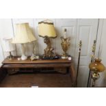 Two brass standard lamps, oil lamp and eight table lamps (11) Condition Report: Available upon