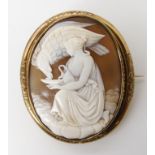 A well carved classical themed shell cameo of Hebe and the eagle in a gold plated mount dimensions