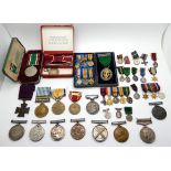 A lot comprising a Korea medal, a USA medal, a territorial medal, a woman's voluntary service medal,