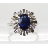An 18ct white gold sapphire and diamond retro ring, size H1/2, weight 3.2gms Condition Report: