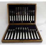 A cased twenty four piece EP and mother of pearl dessert cutlery set Condition Report: Available