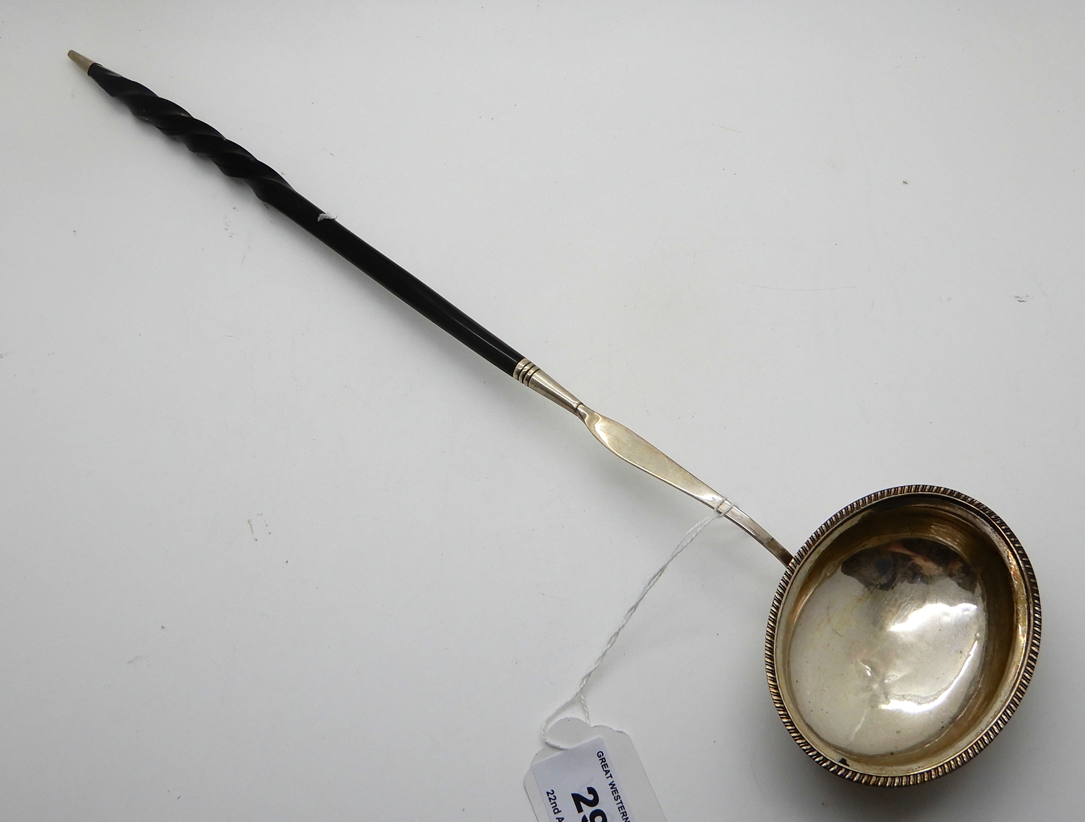 A white metal toddy ladle with whale bone handle, 40cm long Condition Report: Available upon