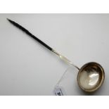 A white metal toddy ladle with whale bone handle, 40cm long Condition Report: Available upon