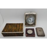 A lot comprising a Goliath pocket watch and silver travel case, a silver cigarette case and a