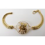 An Arabic Gold bespoke dragon bracelet length 21.2cm, diameter of the dragon rondel 3.1cm, weight