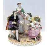 A continental figural group of a couple and a maid Condition Report: Missing a table possibly and