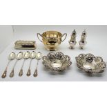 A lot comprising a silver sugar bowl Sheffield 1924, a pair of silver pepperettes, a pair of