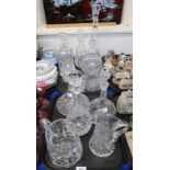 A collection of cut glass and crystal decanters, and four jugs Condition Report: All 20th/21st