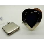 A lot comprising a silver vesta and a heart shaped silver photo frame, 6.5cm high Condition