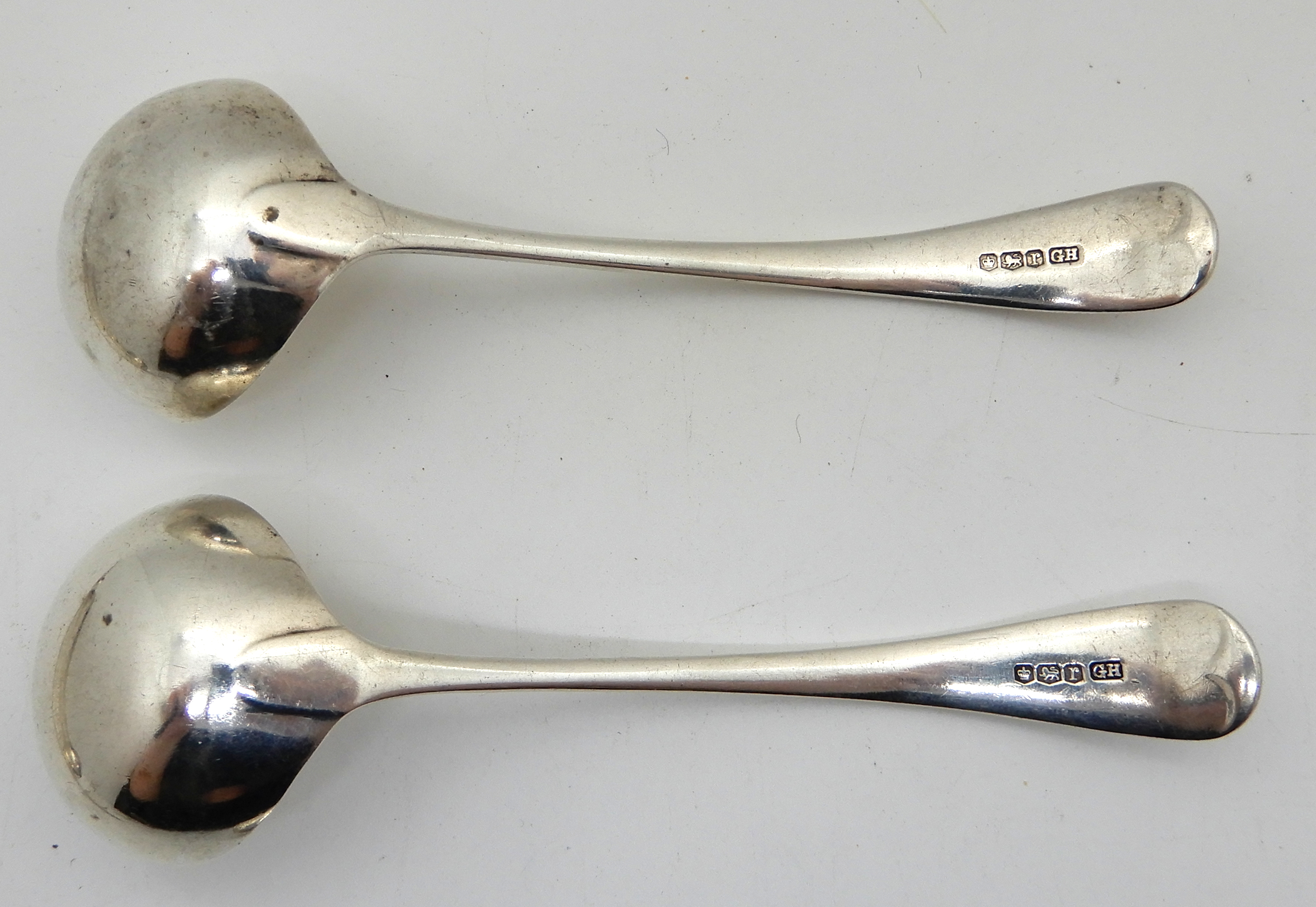 A lot comprising a pair of Georgian silver sugar tongs, London 1814, a pair of silver toddy ladles, - Image 2 of 3