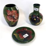 A Moorcroft pottery hibiscus pattern vase 13cm high, a pin dish and an anemone vase Condition