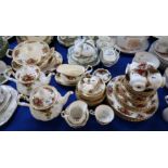 A Royal Albert Old Country Roses tea and dinner service comprising two teapots, five cups, six