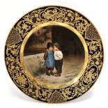 An Vienna porcelain cabinet plate, painted with two boys, titled to the back 'Wicht geheimnis' (