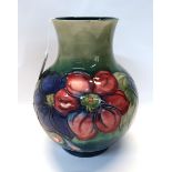 A Moorcroft anemone pattern vase, 23cm high Condition Report: Available upon request
