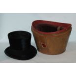 A black top hat by Patrick Thomson Ltd, Edinburgh, 20 x 16cm in brown leather case, no lid Condition