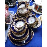 A French porcelain tea set with cobalt blue border Condition Report: