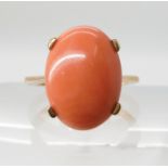 A 9ct gold coral ring, coral 16.2 x 11.9mm, finger size N1/2, weight 5gms Condition Report:
