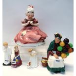 A Hertwig and Co Katzhutte figure of a sitting girl, three Doulton figures Sit, Darling and The