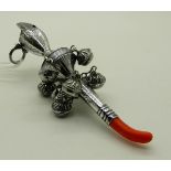 An 800 silver baby rattle with coral teether, 13.5cm long Condition Report: Available upon request