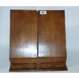 An Edwardian oak stationery box with hinged flaps, 34cm wide Condition Report: Available upon