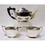 A three piece silver tea service, Sheffield 1944, of rectangular form with canted corners, tea pot