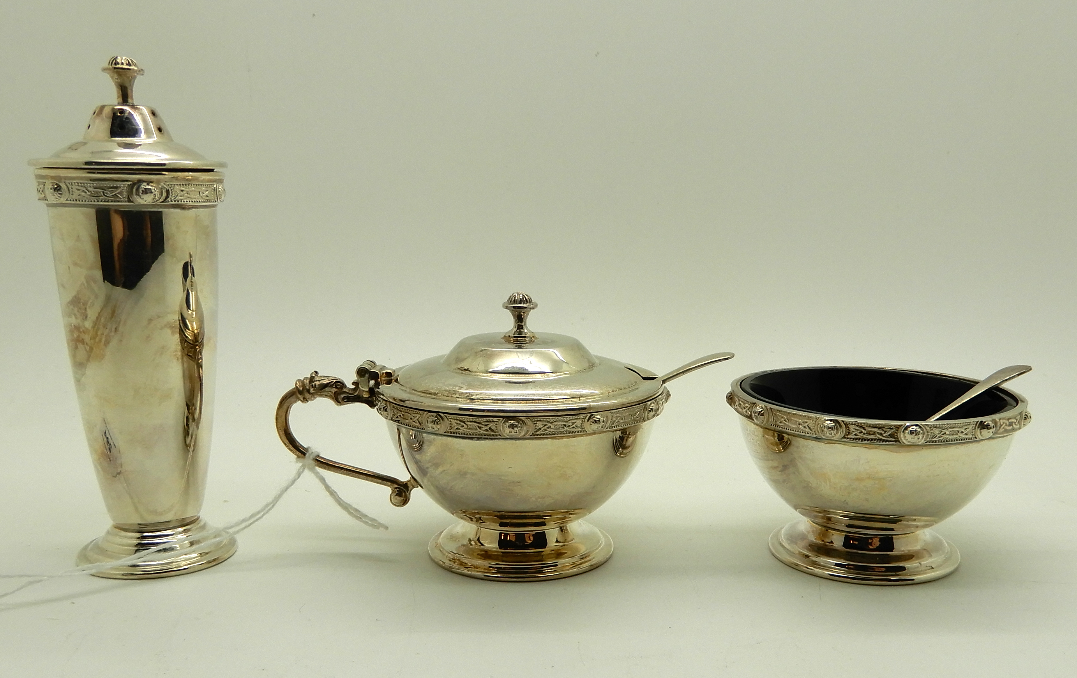 A cased three piece silver condiment set with Celtic decoration, Birmingham 1967 Condition Report: - Image 3 of 4