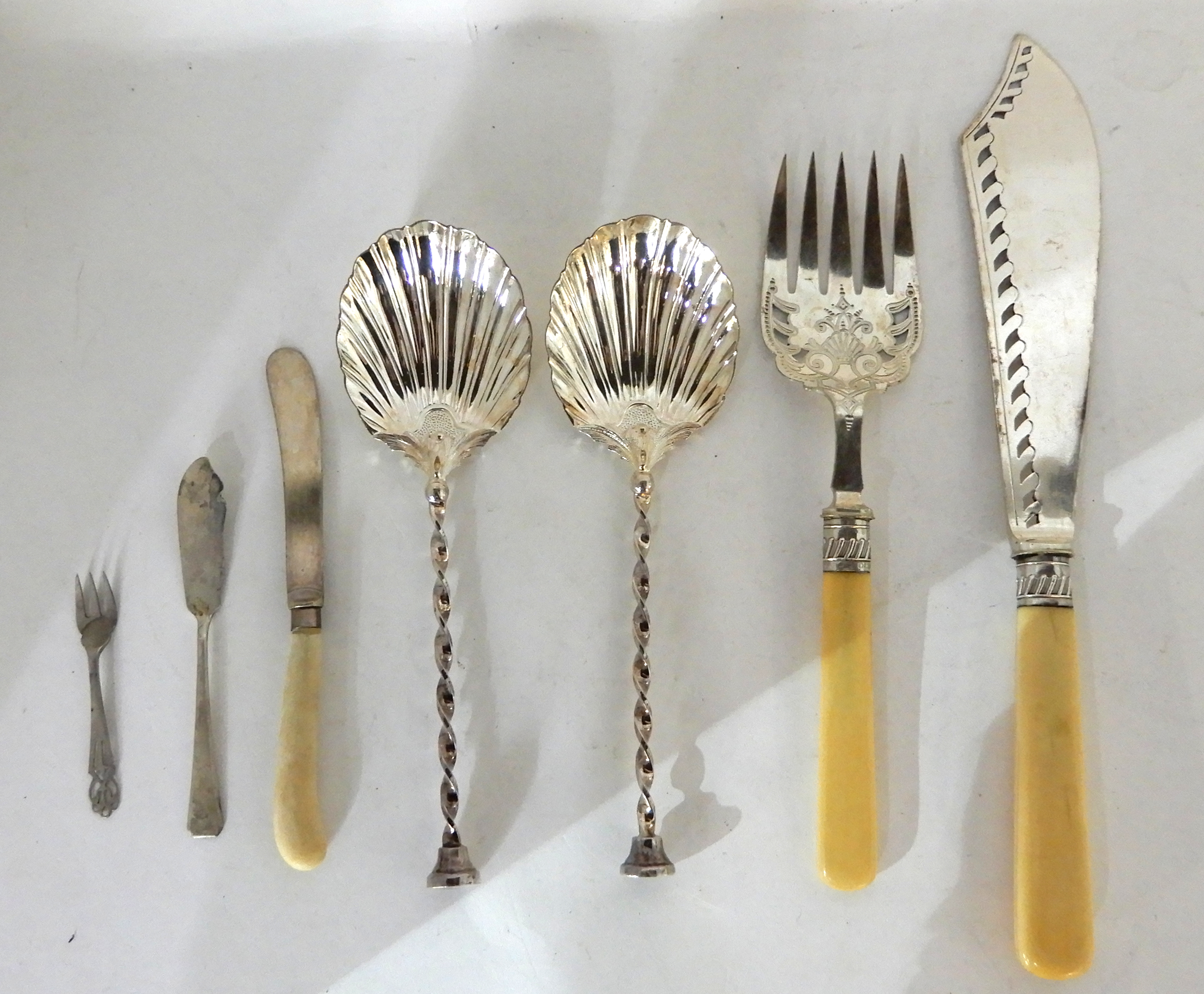 A lot comprising a pair of silver serving spoons, London 1891, a pair of EP servers and three pieces