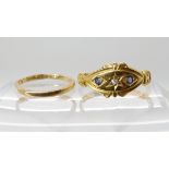 An 18ct gold wedding ring size J, together with an 18ct gold sapphire and diamond ring dated