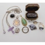 A collection of silver and white metal jewellery to include an amethyst set cross Condition