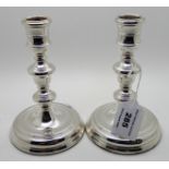 A pair of silver candlesticks, London hallmarks, knopped stems on circular pedestal bases 15cm high,