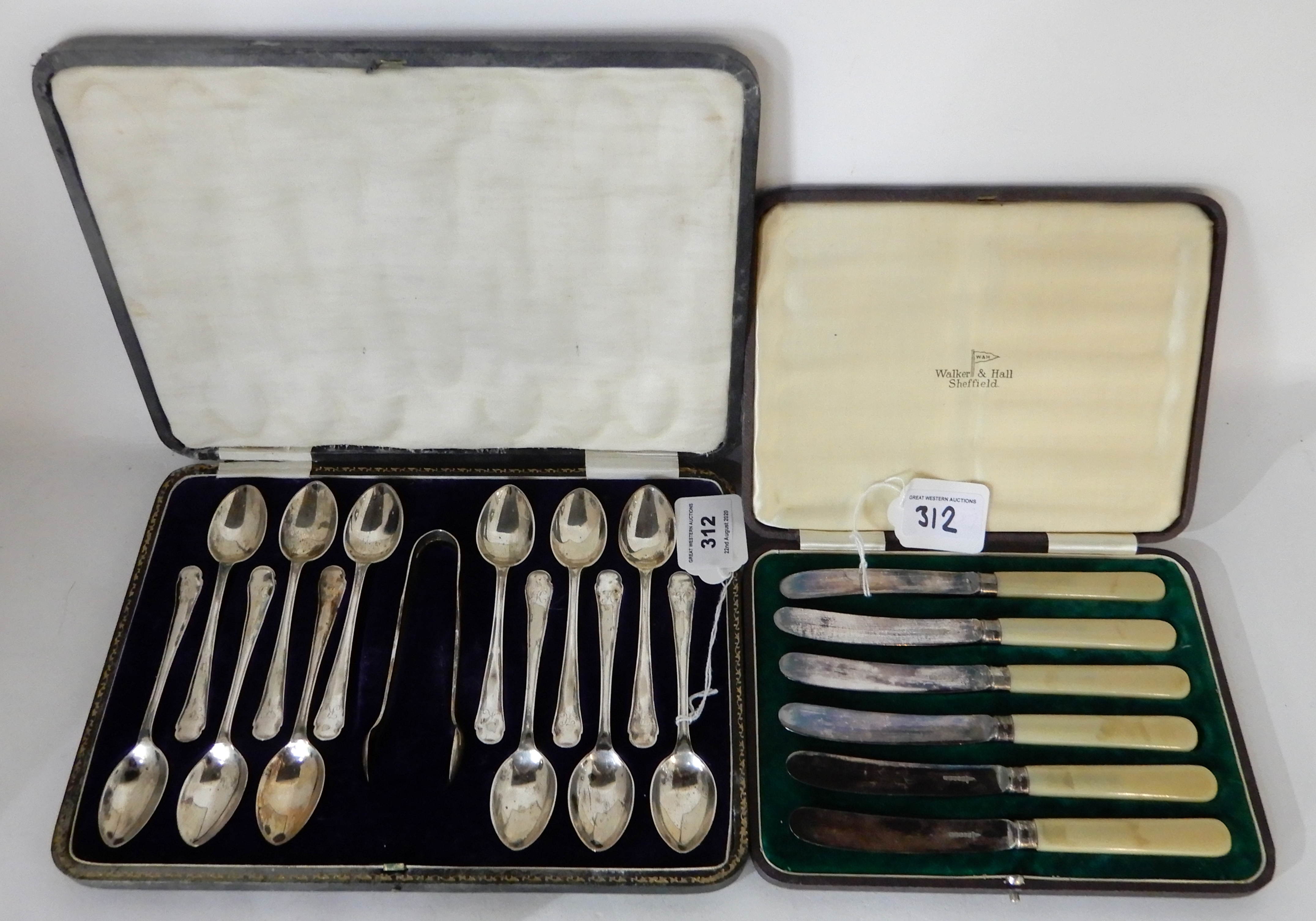 A lot comprising a cased set of twelve silver teaspoons with tongs, Sheffield 1918 and a cased set