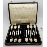A cased set of twelve silver coffee spoons with tongs, Sheffield 1936 Condition Report: Available