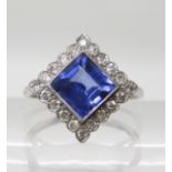 An 18ct white gold and platinum sapphire and diamond ring, head size 11.5mm x 11.5mm, sapphire 7mm x